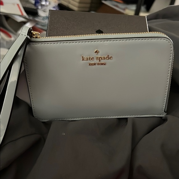 kate spade Handbags - Kate Spade Cream Wristlet In Patent Leather